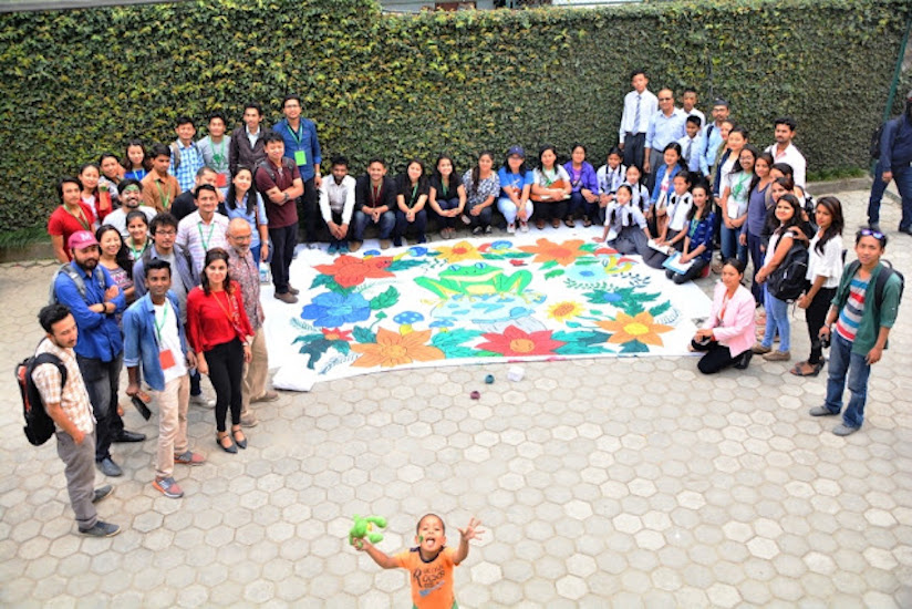 group photo with mural